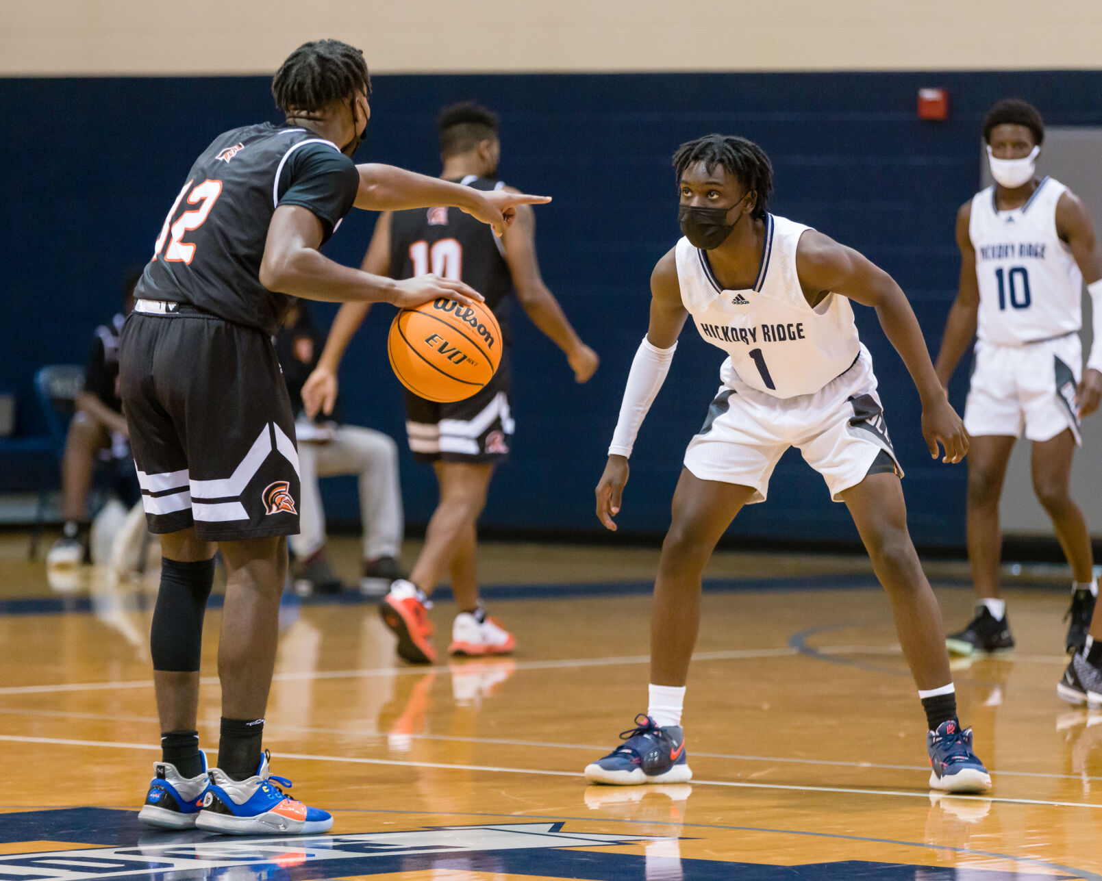 Boys Basketball: Hickory Ridge RaginÕ Bulls defeated the Northwest Cabarrus Trojans 64-56.